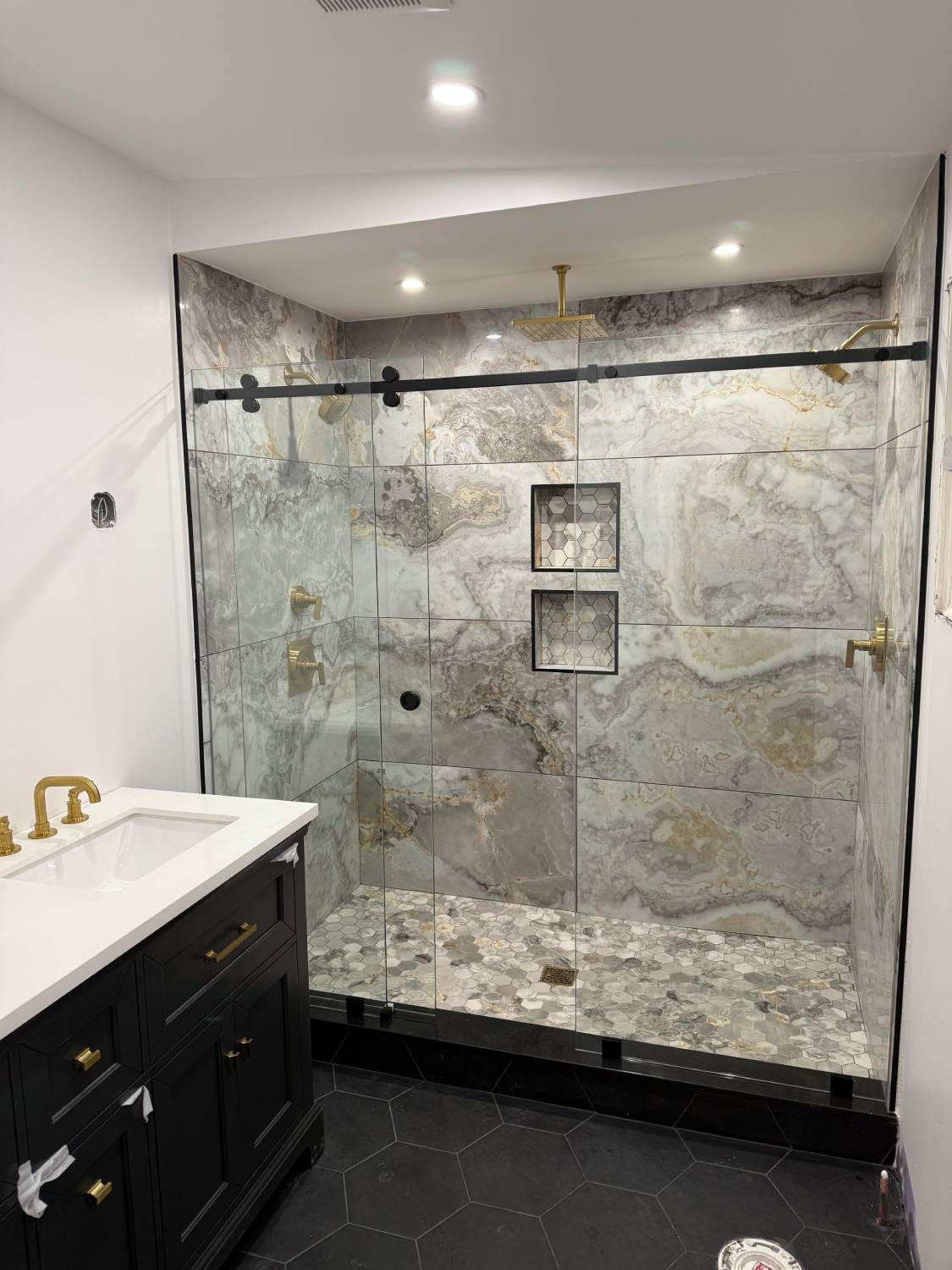 Sliding frameless shower door installation Greater Boston LUXE Glass