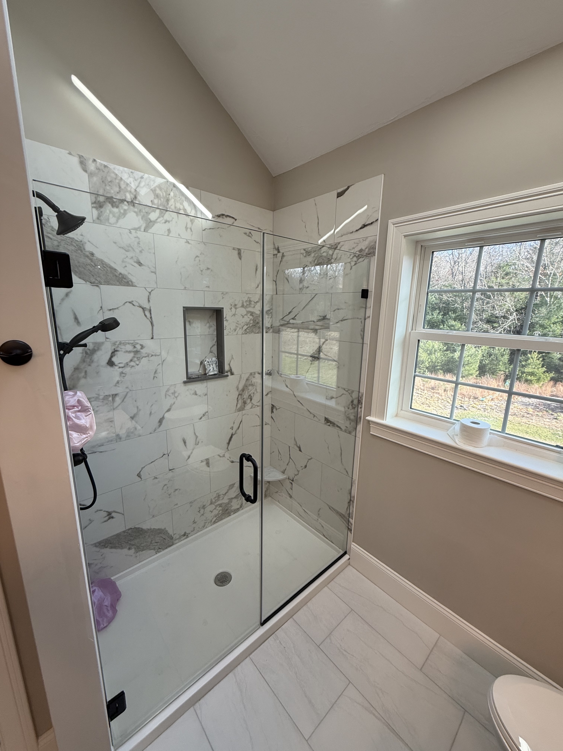 Semi frameless shower door installed in Greater Boston by LUXE Glass